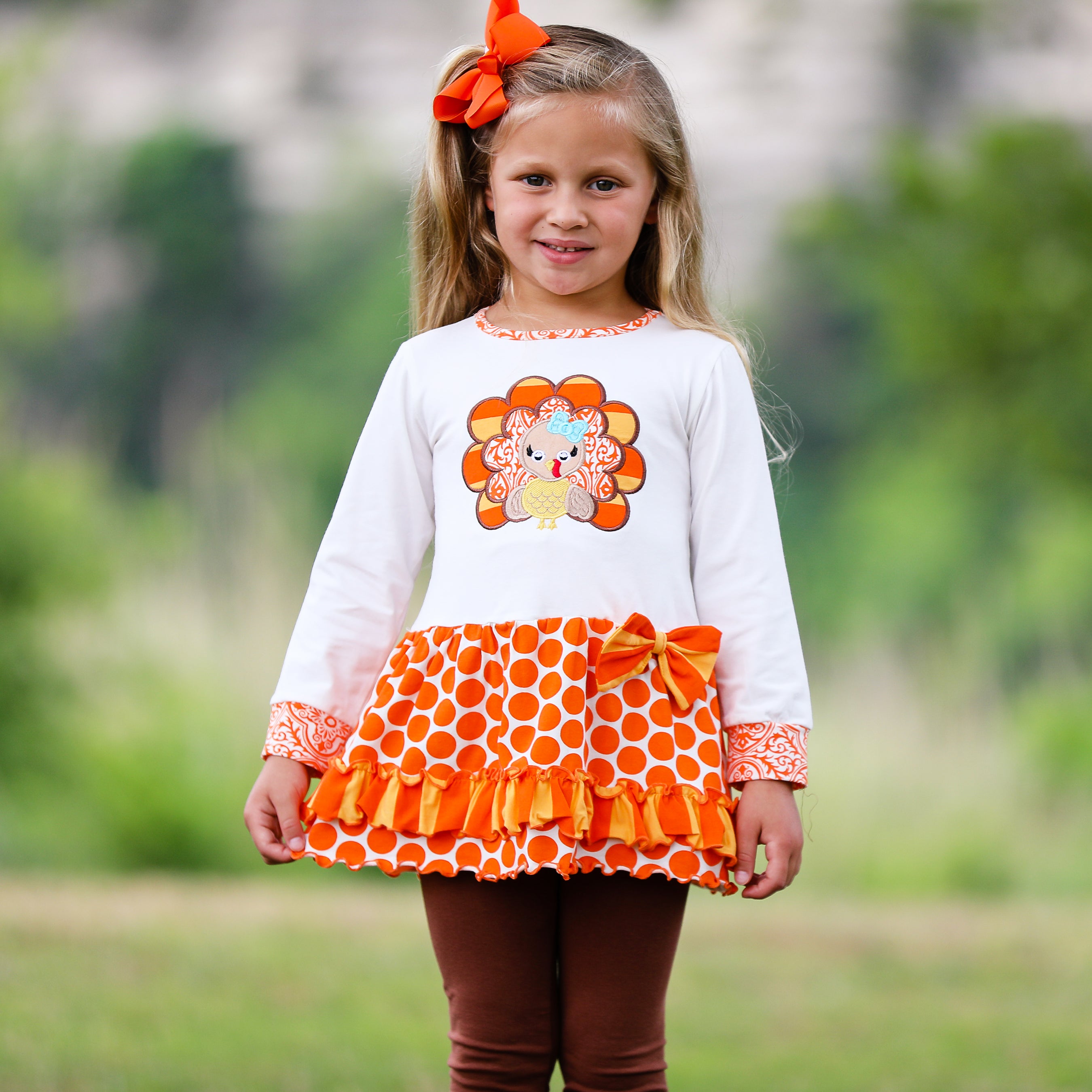 AnnLoren Big Little Girls Autumn Turkey Tunic & Leggings featuring a turkey applique, cream tunic, and orange knit leggings.